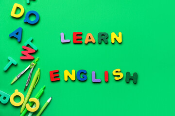Text LEARN ENGLISH with school stationery and letters on green background