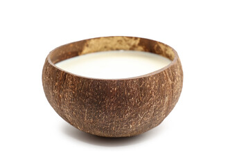 Shell with coconut milk on white background