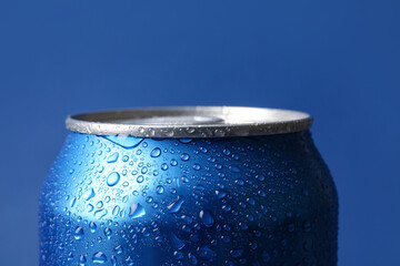 Can of fresh soda with water drops on blue background, closeup - obrazy, fototapety, plakaty