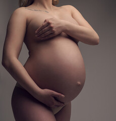 Pregnant naked blonde cropped portrait