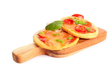 Board with tasty mini pizzas on white background