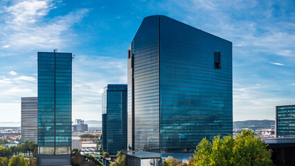 Exterior of a modern office building surrounded by a cityscape - generative ai