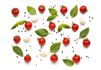 Composition with ripe cherry tomatoes and spices on white background