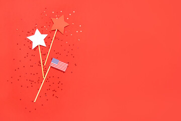 Composition with USA flag, stars and confetti on red background. Independence Day celebration