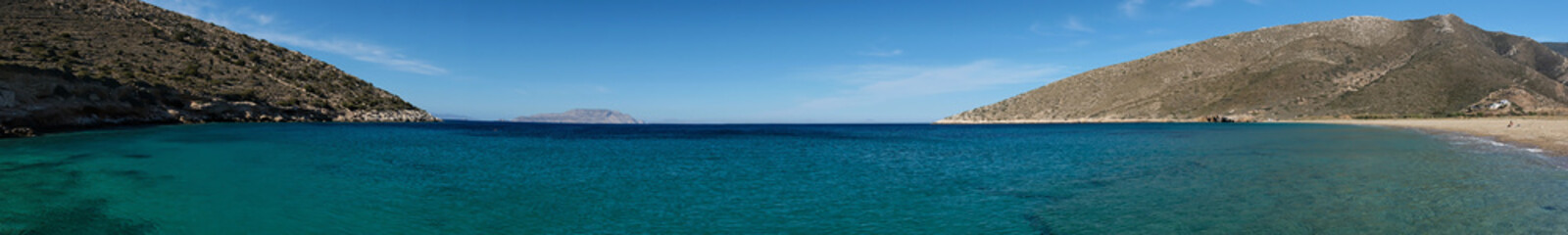 Fototapeta na wymiar Real panoramic view of the stunning turquoise sandy beach of Agia Theodoti in Ios Cyclades Greece