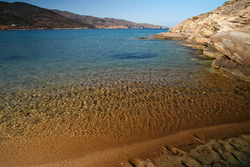 Close up of the beautiful sandy beach and the crystal clear waters of Kalamos in Ios Greece
