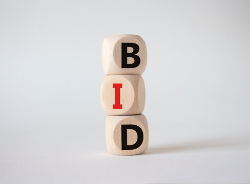 BID symbol. Concept word BID on wooden blocks. Beautiful white background. Business and BID concept. Copy space