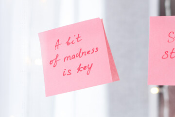 inspirational quotes on pink sticker on the mirror,handwriting text