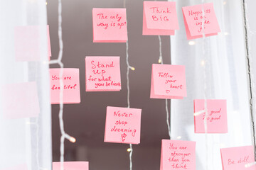 inspirational quotes on pink sticker on the mirror,handwriting text