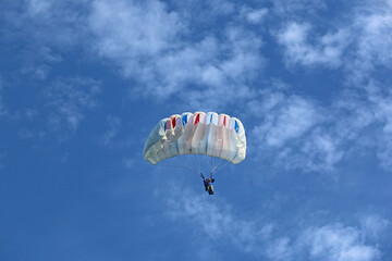 Skydiver flying in a blue sky