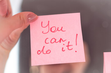 inspirational quotes on pink sticker on the mirror,handwriting text