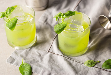 Gin Basil Smash Cocktail refreshment gin, fresh lemon juice, syrup and basil leaves
