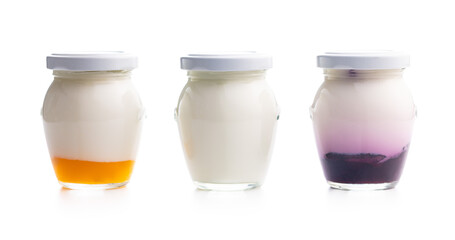 White and fruity yogurt in jar isolated on white background.