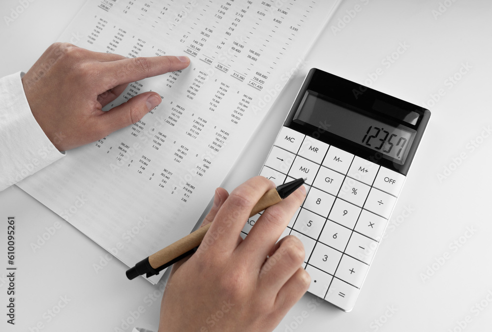Aufkleber accountant using a calculator and points her finger at the numbers in the financial statement.