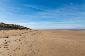 Fototapeta na wymiar Low tide at Formby Beach on a sunny day in spring