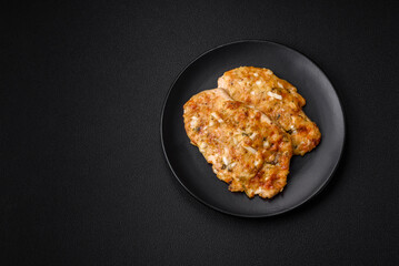 Delicious fried chicken breast in batter with mustard, salt, spices and cheese