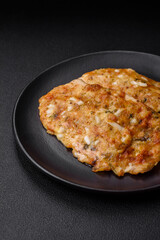 Delicious fried chicken breast in batter with mustard, salt, spices and cheese