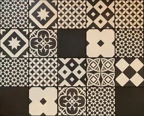 Tapeten Black white traditional ceramic floor or wall tile as a texture for background. Vintage geometric and floral details on Portuguese, Lisbon, Azulejos pattern on ceramic or cement patchwork tiles. © piece_ov_art