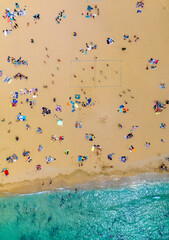 People on the sand beach and sea, top view