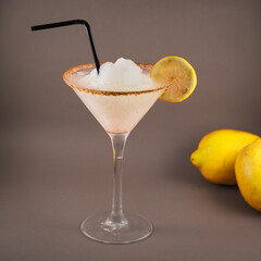 typical mexican drink Margarita with salt and lemon, on gray background
