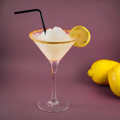 typical mexican drink Margarita with salt and lemon, in purple background