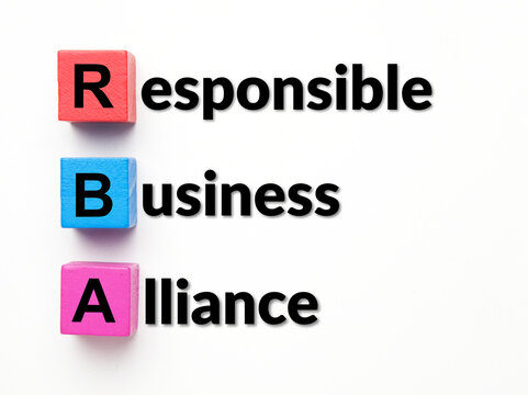 Flatlay picture of wooden block written RBA with Responsible Business Alliance Word.