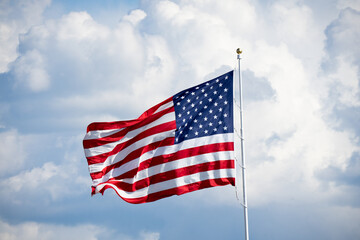 American Flag flying on cloudy day