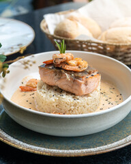 Delicious salmon and shrimp  with cream sauce served with rice