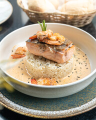 Delicious salmon and shrimp  with cream sauce served with rice
