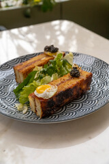 Fancy mini  caviar sandwiches on a blue plate