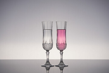 Champagne glass on shiny gray surface