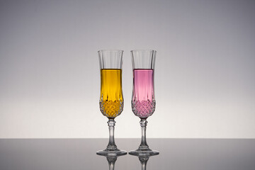 Champagne glass on shiny gray surface