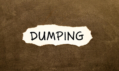 word DUMPING on torn paper, business concept