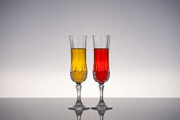 Champagne glass on shiny gray surface