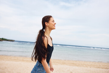 Fototapeta na wymiar woman young summer lifestyle sea smile sunset travel hair running beach