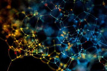 UVIVF Colorful Bubbles shining with fluorescent paint illuminated by UV 365nm ultraviolet blacklight photographed in a studio with a macro lens