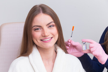Woman wearing bathrobe in beauty clinic, aesthetics, patient, cosmetic procedures. botox...
