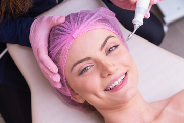 closeup photo of woman's face, photo of aesthetics, anti aging procedures. Plasma jet application....