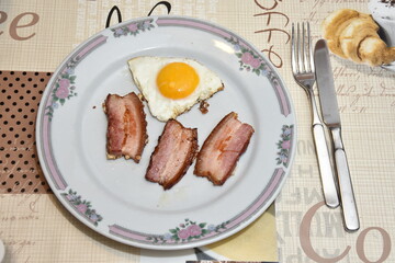 Morning food , Fried egg with bacon in Germany