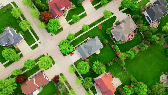 Beautiful neighborhoods, perfect homes in Springtime, aerial drone view.