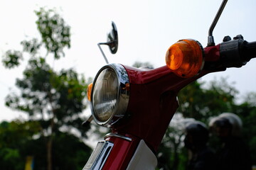 Automotive Photography. Close up view of a 1975 motorbike in red and white .  Bandung - Indonesia