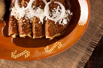 Enchiladas de Mole. Also known as mole poblano enchiladas, they are a typical Mexican dish that is very popular in Mexico and the rest of the world.