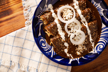 Enchiladas de Mole. Also known as mole poblano enchiladas, they are a typical Mexican dish that is very popular in Mexico and the rest of the world.