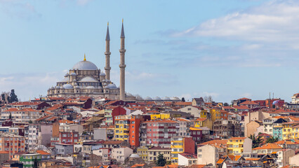 Suleymaniye mosque with colorful residential house area in Istanbul with blue sky background, Turkey, Istanbul Mosque Suleymaniye minaret with colorful house, Beautiful view Istanbul, Turkiye.