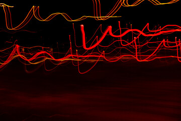 Long exposure, light painting photography, multi color swirl effect against black background. Night...