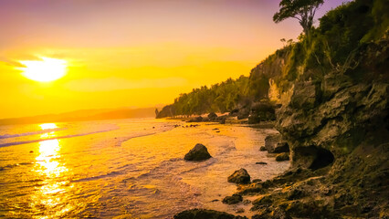 Obraz premium Breaktaking view of coast and high cliffs near Dato Beach, West Celebes, at Sunset. The image is generated with the use of an AI for magical effects