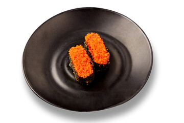 Two pieces of tobiko sushi (flying fish roe sushi) placed on a black plate isolated on white background. popular Japanese food.