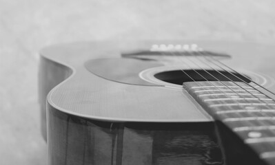 Acoustic guitar close-up, black and white