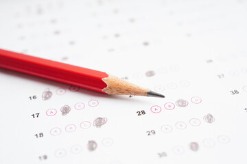 Answer sheets with pencil drawing fill to select choice, education concept.