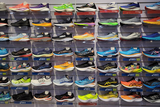 PENANG, MALAYSIA - 27 MAY 2023: Various trendy sport shoe brands are displayed on the shelf in Sport direct store, it is one stop sports fashion, clothing and accessories shop for the biggest brands.